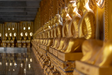 Row of Golden Buddha in Thailand 