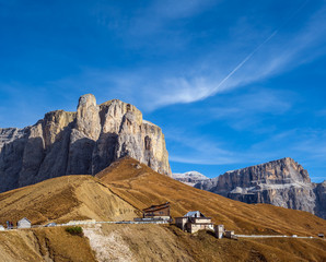 Autumn alpine Dolomites rocky  mountain scene, Sudtirol, Italy. Peaceful view near Sella Pass.