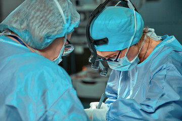 Surgeons team in the operating room, portraits close-up. modern operating, plastic surgery. Beauty industry