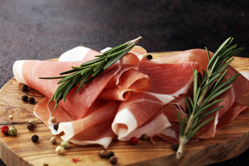 Dry Spanish ham, Jamon Serrano, Bellota, Italian Prosciutto Crudo or Parma ham. meat cutting