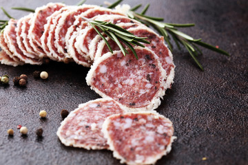 Salami truffle. The saltufo is a piece of salami mixed with summer truffle and parmesan on table