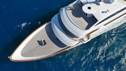 Aerial drone photo of luxury mega yacht docked in Mediterranean destination with deep blue wavy sea - obrazy, fototapety, plakaty