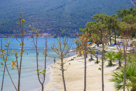 View of Bodrum Beach with Turquoise water, Aegean sea, Mugla, Turkey. Outdoors Summer Travel concept, Aegean style, turkish beach holiday vacation.
