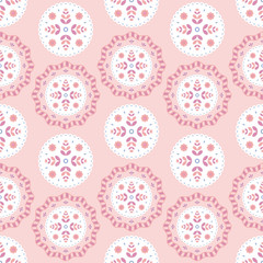 Folk floral ornament. Seamless pattern with abstract flowers on pink background.