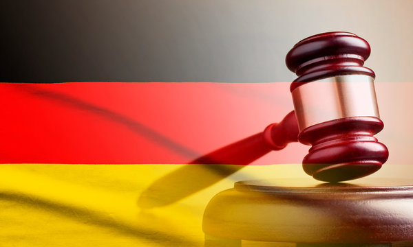 Legal gavel over a flag of the Germany