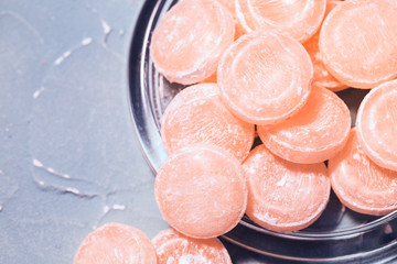 Fototapeta premium Grapefruit throat lozenges, sweet mint drops with citrus flavor