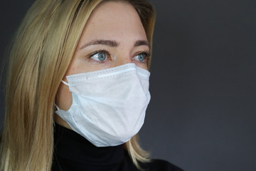 Sick woman wear a medical face mask against virus and protecting herself. Self protection. Dislike...