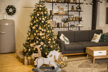 Christmas interior with elegant Christmas tree and rocking horse