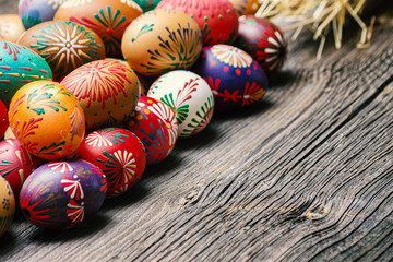 Fototapeta na wymiar Colorful Easter Eggs on Wooden Background