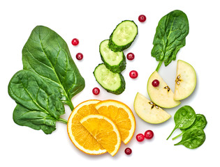 Fresh fruits healthy diet concept. Raw mixed vegan juicy food background, green salad, cucumber, orange isolated on white. Variety of fresh green veg fruit for juice or smoothie.