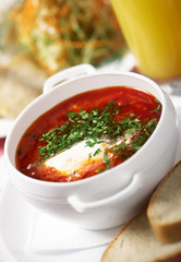 Borscht in a bowl with bread