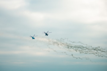 Obraz premium Military helicopter fired anti-armor missiles at sunset