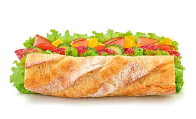 Fresh submarine sandwich with ham, cheese, salami, tomato, lettuce salad, cucumber isolated on white. Colorful tasty baguette homemade large sub sandwich with vegetables. Fast food concept