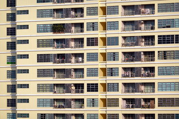 Fototapeta premium Building with many balconies and windows.
