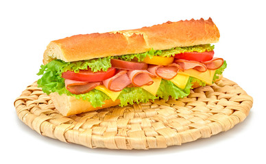 Fresh submarine sandwich on plate with ham, cheese, tomato, lettuce salad, isolated on white. Colorful tasty baguette homemade large sub sandwich with vegetables. Fast food concept