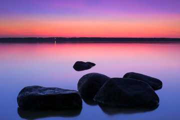 sunset sky over the lake. Evening lake. Pink sky