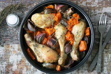 Baked chicken legs with pumpkin and blue onions. Healthy food. Keto diet.