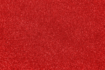 Abstract red glitter shiny bokeh background. Festive texture.