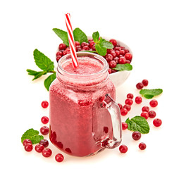 Cranberry smoothie in glass jar, healthy juicy pink vitamin drink, diet or vegan food concept. Freshly blended homemade fruit vitamins juicy cocktail. Tasty organic berries smoothie