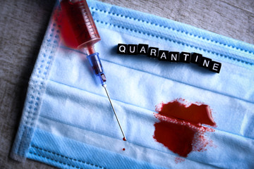 Coronavirus blood analysis concept.Wuhan, China 2020.Respiratory mask with a trace of blood,...