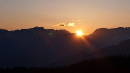 orange sky in the morning over the austrian alps