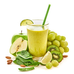 Freshly blended green fruit smoothie in glass, healthy detox vitamin diet or vegan food concept. Raw fresh vitamins smoothie drink with spinach, apple, grapes isolated on white.
