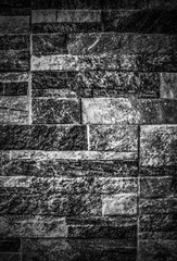 A background of stone wall in black and white close up view