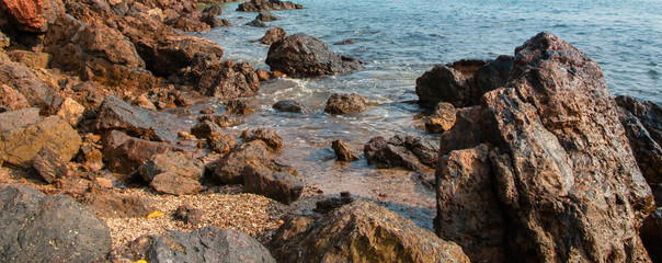 Sea landscape. Evening on the stone beach.