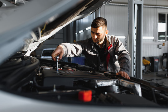 Auto Mechanic Working At Auto Repair Shop