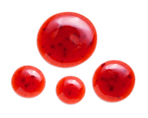 red raspberries jam splash isolated on white background