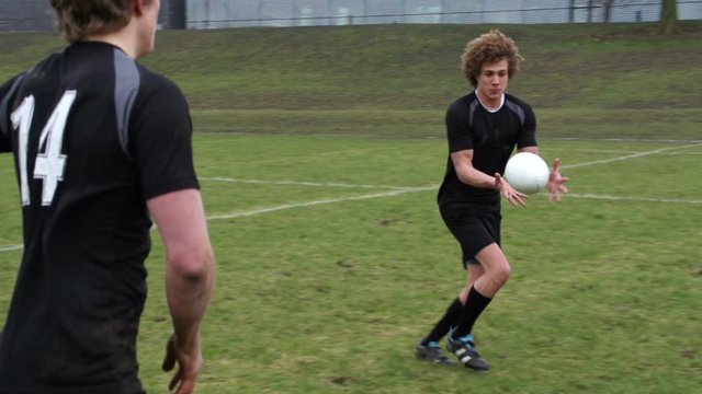 Rugby Match. Two teams on the rugby field battling for the ball. Slow motion Speed Ramping - Stock Video Clip Footage