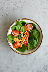 Spinach salad with tomatoes, carrots and chickpeas. Detox, healthy eating concept