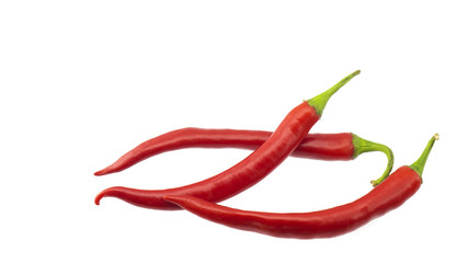 Pods of burning red pepper on a white background