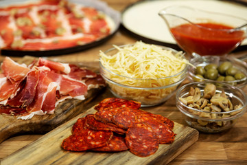 Ingredients for pizza on the table.