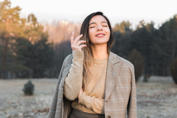 feminist movement. cheerful woman in casual clothes enjoying her existence out in nature