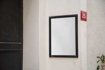 Blank billboard on building wall