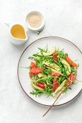 Detox grapefruit and arugula salad, top down view