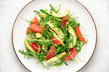 Detox grapefruit and arugula salad, top down view