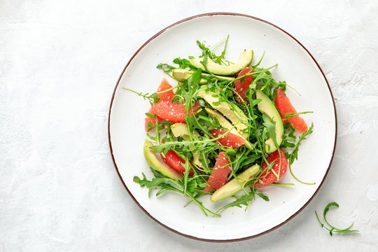 Detox grapefruit and arugula salad, top down view