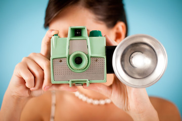 Retro Young Woman Taking a Photo with a Vintage Camera, Photography