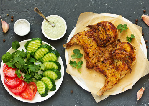 Tapak roast chicken with vegetables and peanut sauce. Shooting from above.