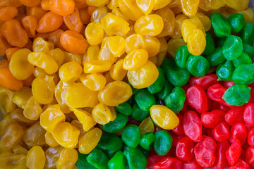 top view of fruits of multi-colored dried kumquat. Green, yellow red kumquat fruit. Healthy diet food. Vegetarianism