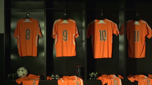 Soccer /  Football Changing room / Locker room. All the kit or uniform is laid out ready for the players.&nbsp;