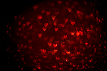 Background with red bokeh in the shape of a heart. Valentine's day concept.