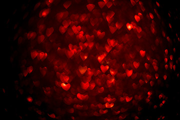 Background with red bokeh in the shape of a heart. Valentine's day concept.