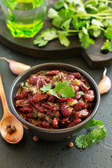 Stewed red beans with spices and cilantro, hot pepper. Lobio. Chile con carne.