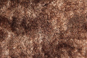 Sheepskin is brown with beige color.