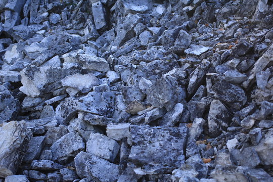 big gray rock stones dropped on ground. rockfall scene