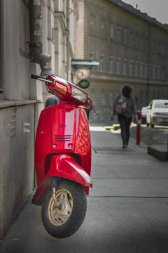  red motorcycle on the street of the old city