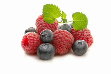 Fresh raspberries and blueberries isolated
